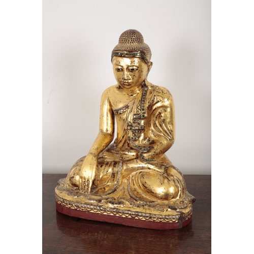 620 - A BURMESE GILT-LACQUERED SEATED BUDDHA

late 19th/early 20th century, figured seated with legs cross... 