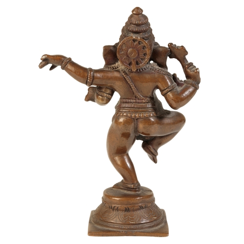 629 - A SMALL BRONZE FIGURE OF GANESH

20th century, figured on a square plinth base, 15.5cm high