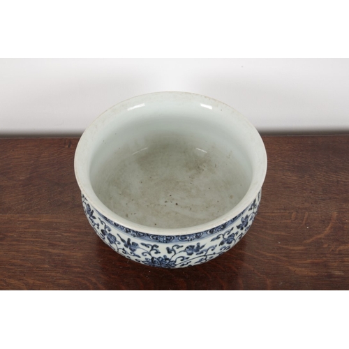 631 - A LARGE CHINESE BLUE AND WHITE 'LOTUS' JARDINIERE

early Ming style but later, the body decorated wi... 