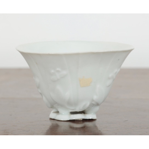 636 - A CHINESE BLANC DE CHINE LIBATION CUP,

early Qing, 9cm wide; and a Chinese bowl enamelled in polych... 