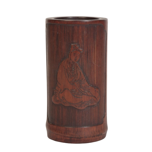 642 - A CHINESE BAMBOO BRUSH POT

carved with a seated figure in a rectangular panel with re-entrant corne... 