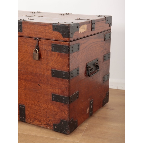 645 - A LATE VICTORIAN OAK AND METAL BOUND PLATE CHEST

the hinged lid opening to a baize lined interior, ... 