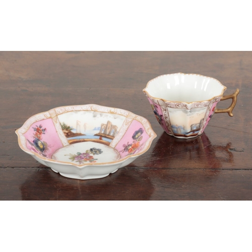 651 - A VIENNA PORCELAIN CUP AND SAUCER

19th century, marked to the base, decorated with alternating pane... 