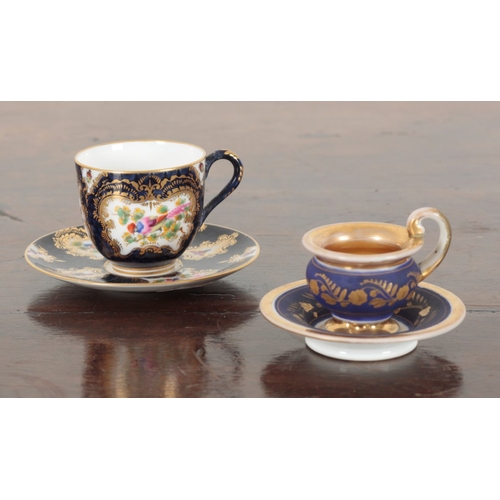 664 - TWO CABINET CUPS AND SAUCERS

including a Royal Worcester example, 5cm high, and another by Paris po... 