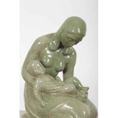 678 - AN ART DECO STONEWARE GROUP OF THE MADONNA AND CHILD

monogrammed LC and dated 1931 to the base, 30c... 