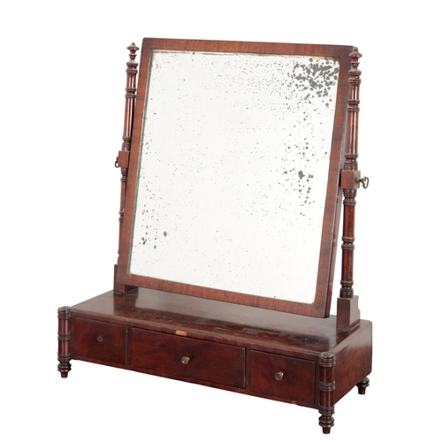 852 - A REGENCY MAHOGANY DRESSING MIRROR

the rectangular plate held on ring turned supports, the base wit... 