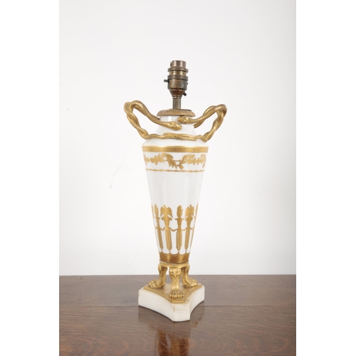 921 - A CONTINENTAL PORCELAIN AND ORMOLU MOUNTED TABLE LAMP

early 19th century, of Neoclassical design, w... 