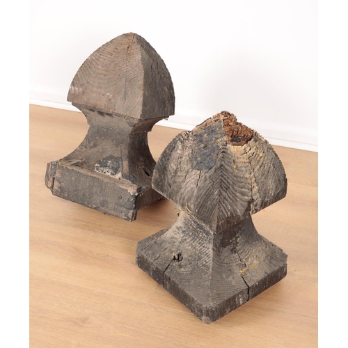 10 - A PAIR OF BLACK-PAINTED OAK GATE POST FINIALS on stepped pedestal bases, 45cm high x 27cm square (2)... 