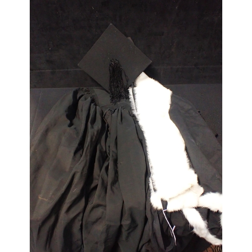 109 - A VINTAGE ACADEMIC CAMBRIDGE GOWN 'mortar board' hat (A.E.Clothier, King's Parade Cambridge), and fu... 