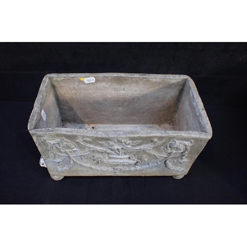 12 - A NEOCLASSICAL STYLE CAST LEAD PLANTER with vase and swag decoration in relief, and lion mask and br... 