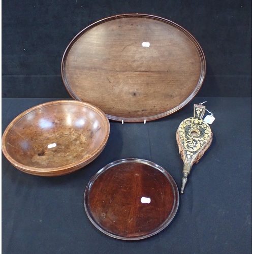 120 - A TURNED TREEN COUNTRY BOWL 33 cms diam, with two mahogany trays and a pair of bellows