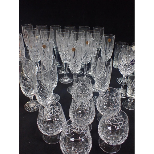 127 - A COLLECTION OF CRYSTAL DRINKING GLASSWARE mostly champagne glasses to include Edinburgh crystal