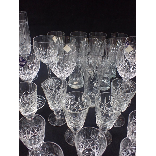 127 - A COLLECTION OF CRYSTAL DRINKING GLASSWARE mostly champagne glasses to include Edinburgh crystal