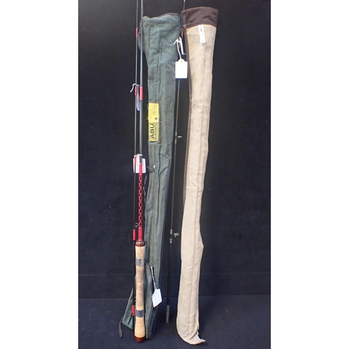 134 - MITCHELL BROWN: A TWO PIECE CARBON SPINNING ROD in the original canvas rod bag; an Abu Garcia two pi... 