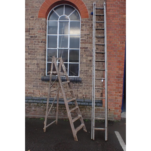 14 - A VINTAGE WOODEN STEPLADDER and an old wooden long ladder (weathered, for decorative use only)