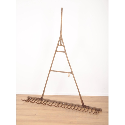 15 - AN ASH 'NAG' RAKE late 19th/early 20th century, with cast iron mounts, 176cm x 152cm (woodworm)