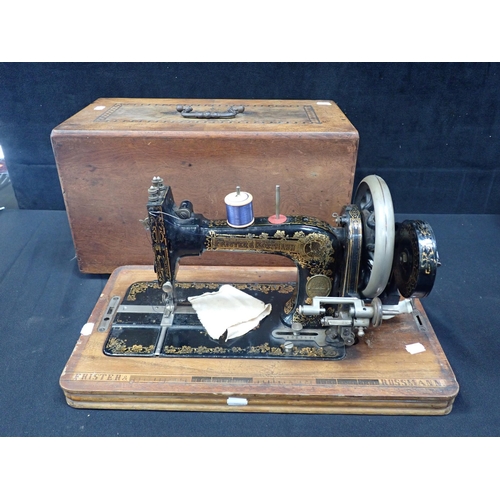 150 - A FRISTER & ROSSMANN SEWING MACHINE WITH TRANSVERSE SHUTTLE and Japanned decoration, the base with p... 