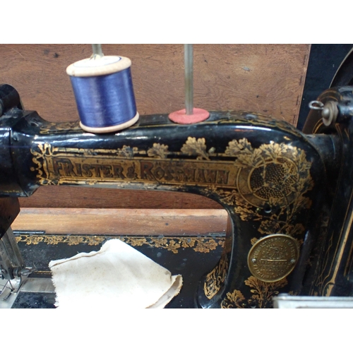 150 - A FRISTER & ROSSMANN SEWING MACHINE WITH TRANSVERSE SHUTTLE and Japanned decoration, the base with p... 