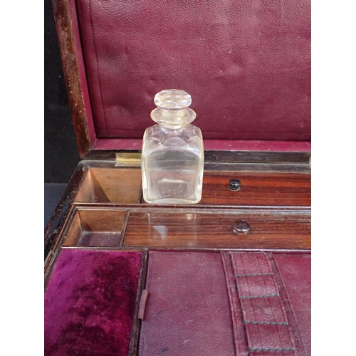 160 - A VICTORIAN ROSEWOOD DRESSING BOX with fitted interior, and mother-of-pearl cartouche 30cm wide