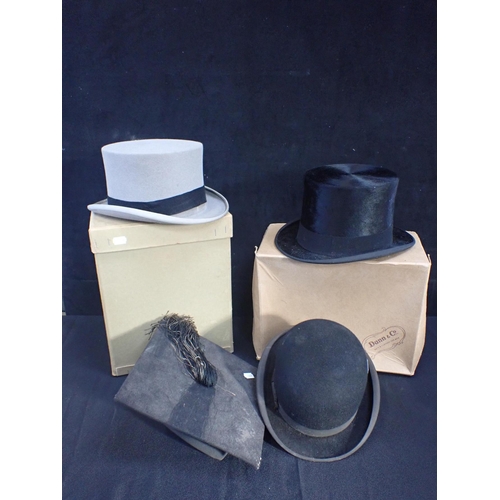 192 - A COLLECTION OF HATS including two boxed top hats, one Dunn & Co, a bowler and a mortar board