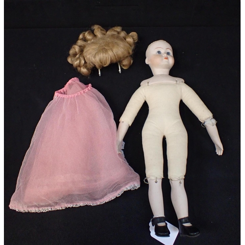 216 - A SIMON & HALBIG BISQUE HEAD DOLL No. 117, with bisque shoulders, legs and arms 40cm high