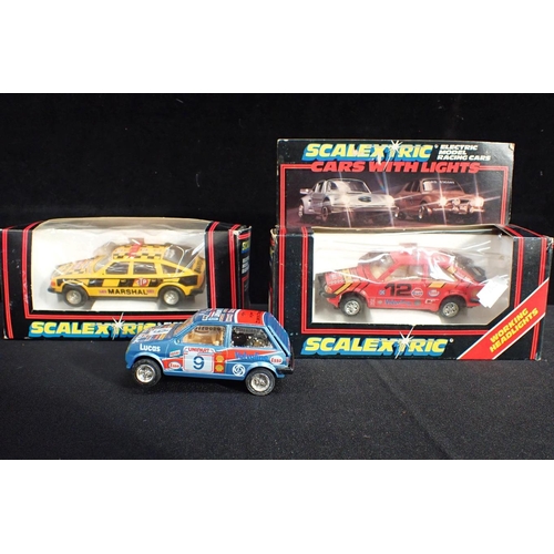 217 - SCALEXTRIC three cars, two boxed, track and accessories