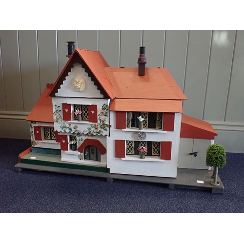 226 - A RESTORED AND FURNISHED COTTAGE STYLE DOLLS HOUSE probably TRI-ANG 84cm wide