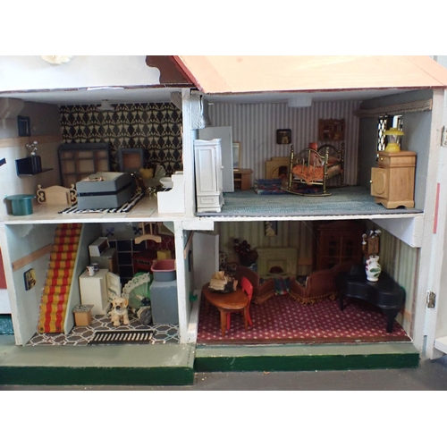 226 - A RESTORED AND FURNISHED COTTAGE STYLE DOLLS HOUSE probably TRI-ANG 84cm wide