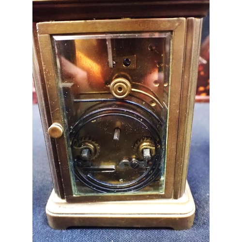 243 - A BRASS CARRIAGE CLOCK, STRIKING ON A GONG 15cm high, handle up,with leather outer case (runs, no ke... 