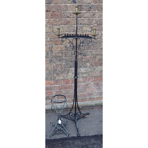 245 - A GOTHIC REVIVAL IRON AND BRASS THREE-BRANCH LAMP floor standing, partly fitted for electricity 132c... 