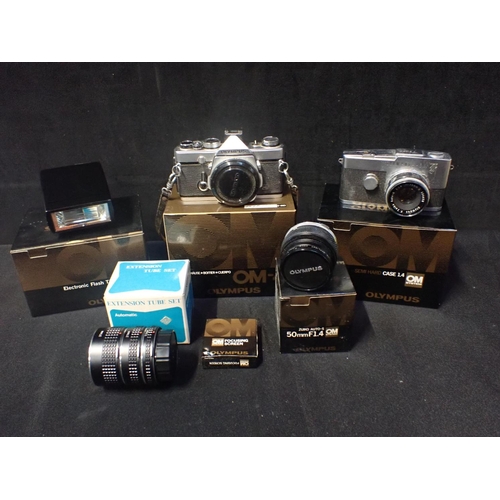 278 - AN OLYMPUS OM-1 35MM SLR CAMERA BODY together with an Olympus Pen-F 35mm bridge camera and a box con... 