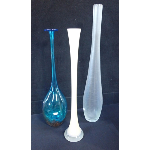 292 - THREE ART GLASS VASES the tallest with all-over irregular facets and polished pontil, 73cm, the blue... 