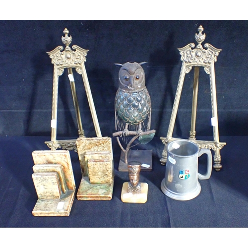 43 - A PAIR OF RENAISSANCE STYLE BRASS EASELS 42 cms high, with an owl night-light holder, a tankard an E... 