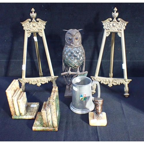 43 - A PAIR OF RENAISSANCE STYLE BRASS EASELS 42 cms high, with an owl night-light holder, a tankard an E... 