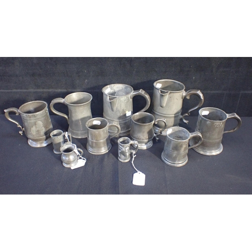 73 - A COLLECTION OF ANTIQUE PEWTER PUB MEASURES including a James Yates quart jug (11)