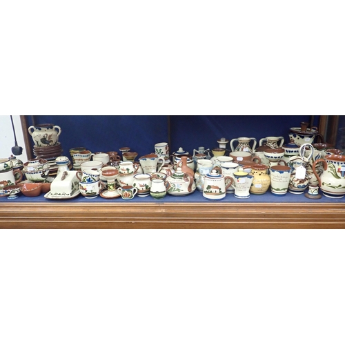 84 - A COLLECTION OF DEVON/TORQUAY POTTERY; ALLER VALE, WATCOMBE etc, slip decorated, some motto ware, ma... 