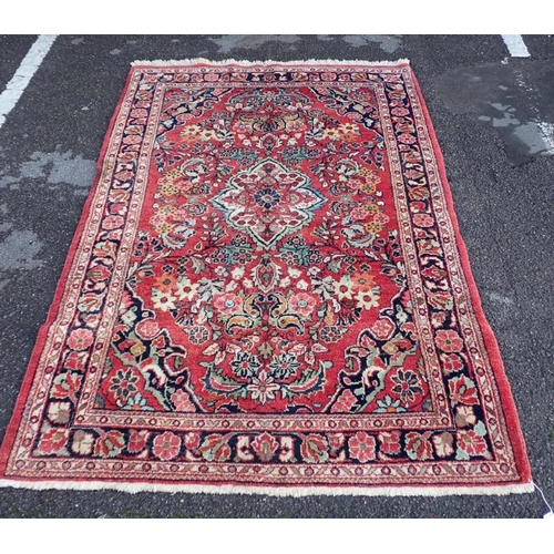 870 - A HAMADAN RUG woven in colours with lozenge central medallion, floral filler motifs and spandrels on... 