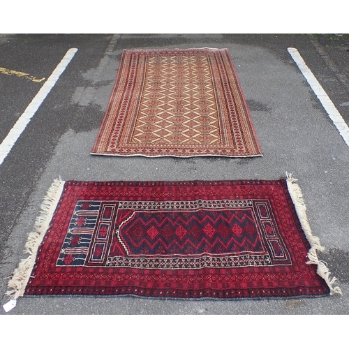 871 - A BELUCH PRAYER RUG woven in blue and white with arch and motifs on a red ground, 137 x 83cm, and an... 