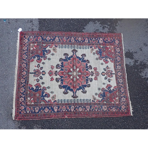 874 - AN ANTIQUE N. W. PERSIAN RUG with central medallion on an ivory field 145 x 116cm (moth damaged)