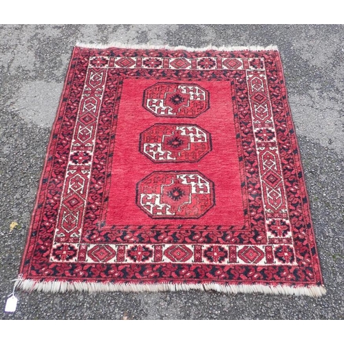 875 - A BELOUCH RUG OF TURKMAN DESIGN 113 x 102cm