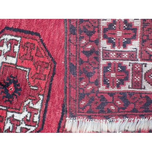 875 - A BELOUCH RUG OF TURKMAN DESIGN 113 x 102cm