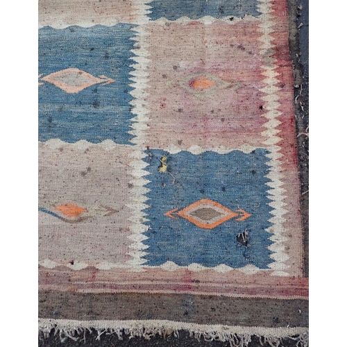 877 - AN AFGHAN LABIJAR FLATWEAVE RUG 184 x 330cm (badly moth damaged) Provenance: The Estate of the late ... 