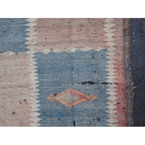 877 - AN AFGHAN LABIJAR FLATWEAVE RUG 184 x 330cm (badly moth damaged) Provenance: The Estate of the late ... 