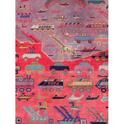 879 - AN AFGHAN 'WAR RUG' WORKED ALL OVER WITH WEAPONS, VEHICLES AND OTHER TOPICAL MOTIFS 97 x 156cm plus ... 