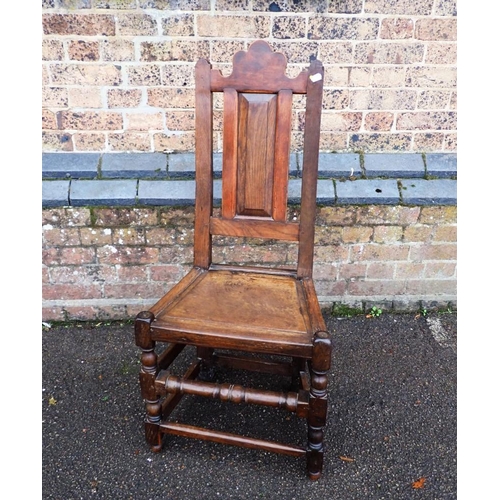 886 - AN OAK AND MAHOGANY COUNTRY CHAIR OF 17TH CENTURY DESIGN with fielded panel seat and back , in a mix... 