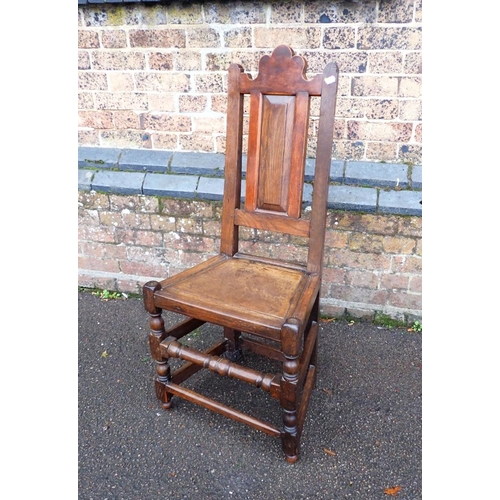 886 - AN OAK AND MAHOGANY COUNTRY CHAIR OF 17TH CENTURY DESIGN with fielded panel seat and back , in a mix... 