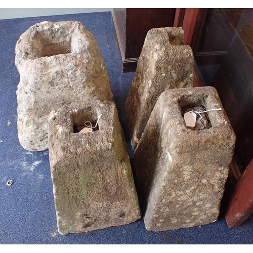 9 - FOUR STONE BASES, OF TAPERING FORM with sockets for posts, perhaps for a cart lodge or similar (vary... 