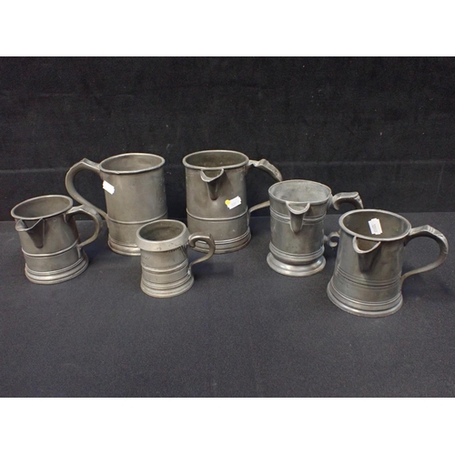 91 - SIX ANTIQUE PEWTER PUB MEASURES/MUGS various sizes and shapes, all engraved with pub names (6)