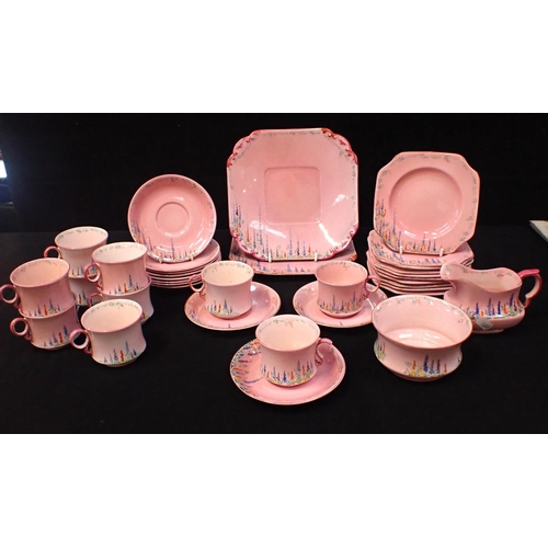 93 - A CARLTON CHINA POTTERY TEA SERVICE decorated on colours with flowers on a pink ground, comprising t... 