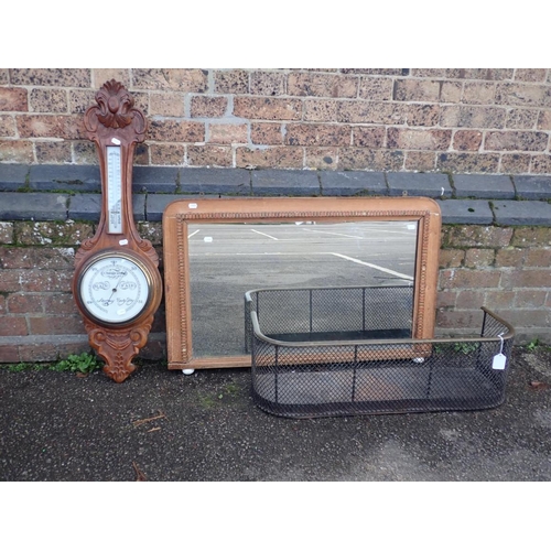 94 - A VICTORIAN WIRE WORK FENDER with brass trim, length 77 cms, with a barometer with carved wood mount... 